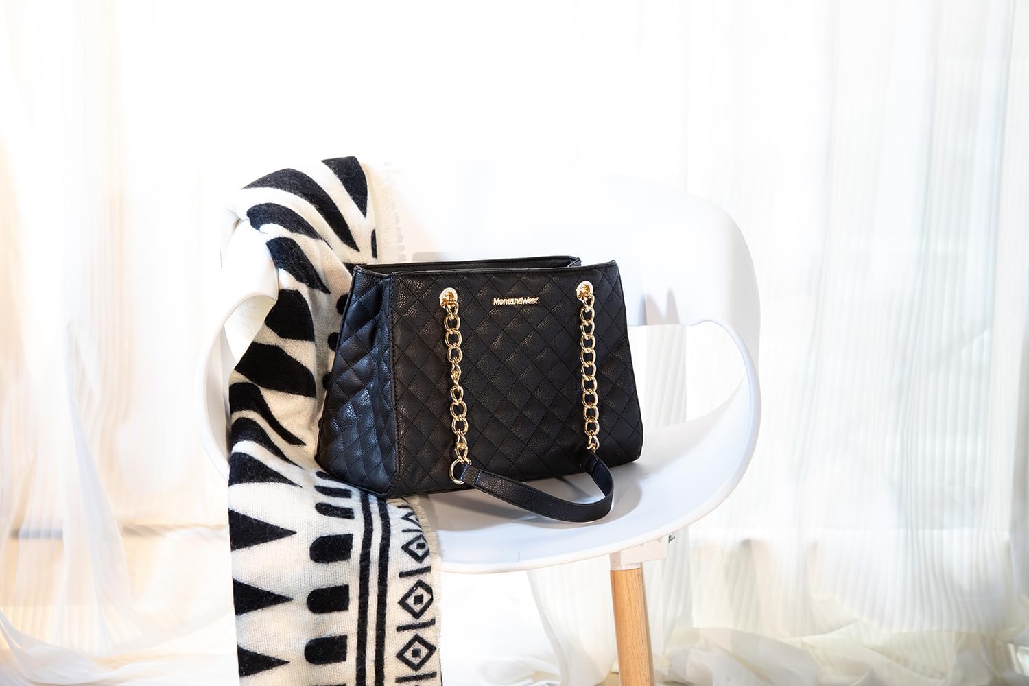 Quilted chain leather tote bag in neutral color, shown with shoulder strap — view 2